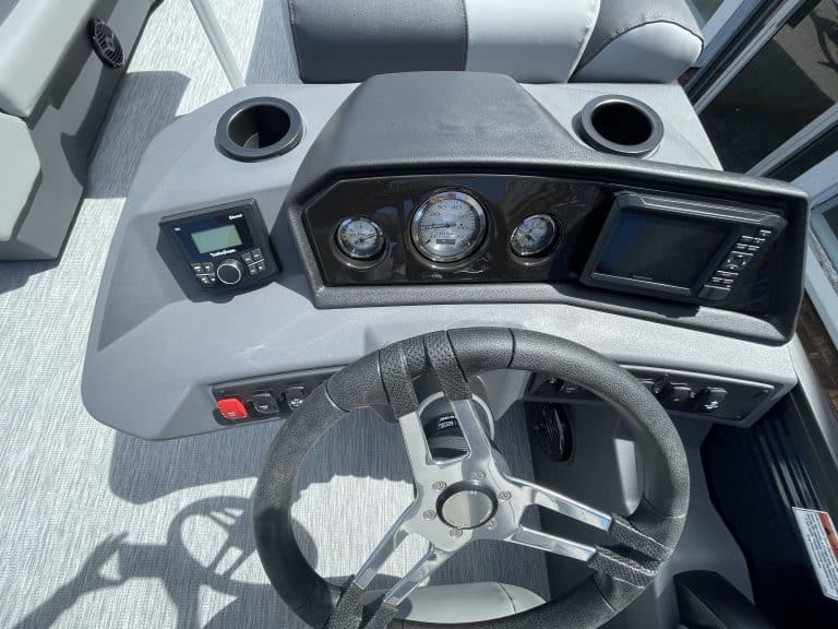 Boat dashboard with gauges and navigation system in Bennington 22S1 SSR.