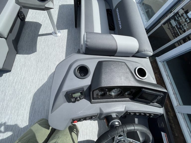 Golf cart dashboard with controls and steering wheel at Hall's Sport Center.