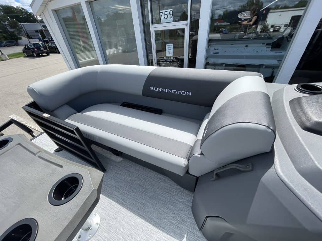 Bennington boat seating with gray and white cushions at Hall's Sport Center.
