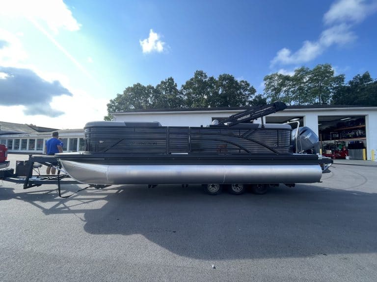 Bennington 22S1 SSR pontoon boat parked outside a service center.