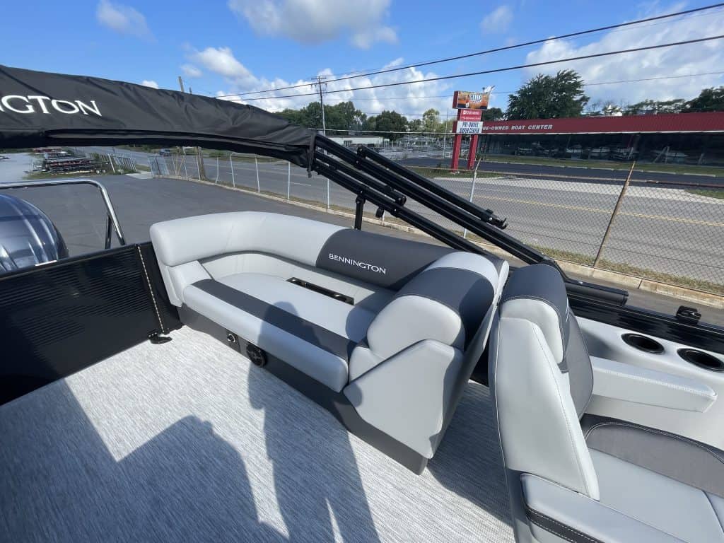 Luxury Bennington pontoon boat with seating and canopy at Hall's Sport Center.