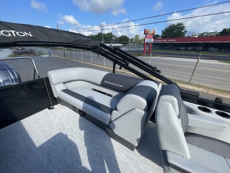 Luxury Bennington pontoon boat with seating and canopy at Hall's Sport Center.