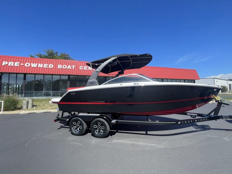 Four Winns H2 boat on trailer outside Hall's Sport Center.
