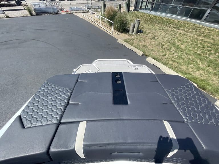 Close-up of the boat deck with textured pads and black striping.