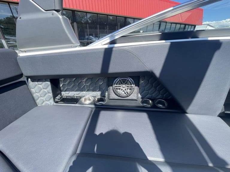 Close-up of the boat's interior with speakers and storage compartments.
