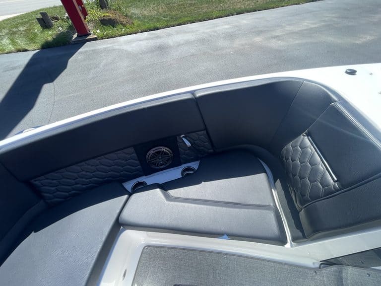 Close-up of the interior seating and dashboard of a Four Winns H4 boat.