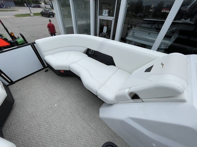 Luxury white boat seating inside Hall's Sport Center showroom.