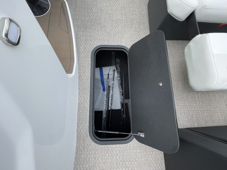 Golf club storage compartment with clubs at Hall's Sport Center.