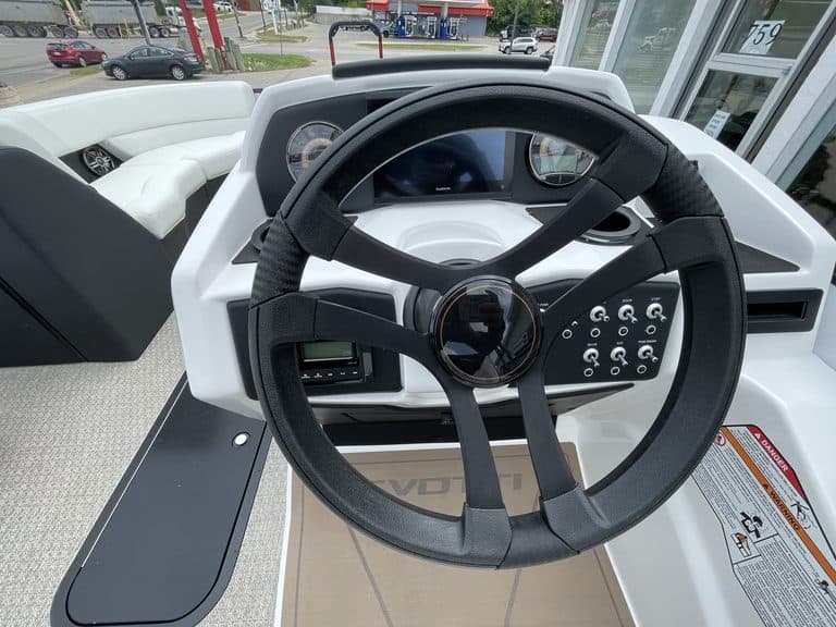 Boat dashboard with steering wheel and control panel for 2027 EVOTTI 523CL.