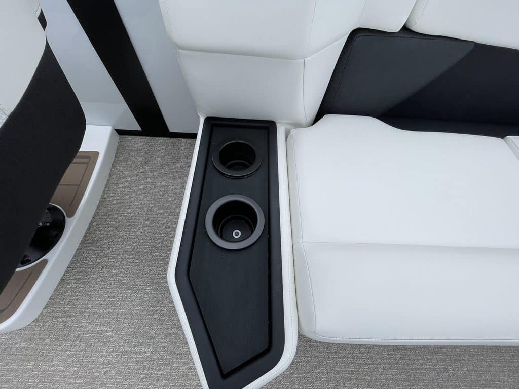Close-up of a boat's interior with speakers and seating.