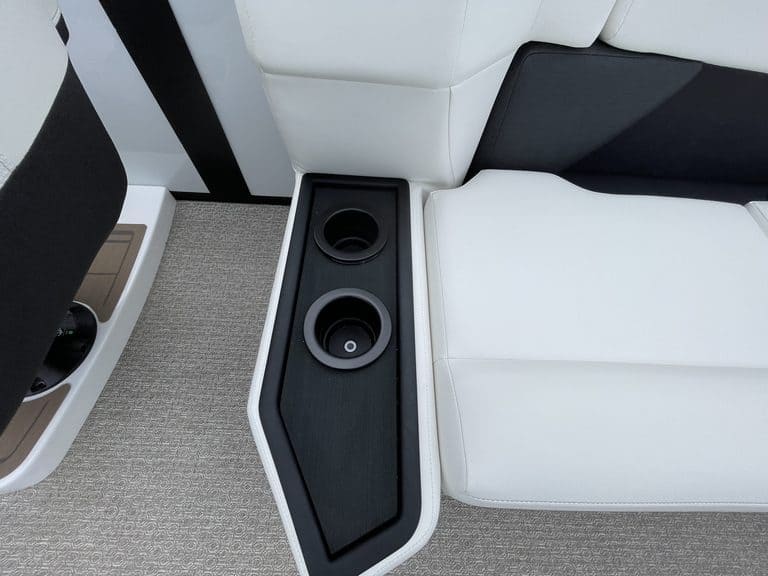 Close-up of a boat's interior with speakers and seating.