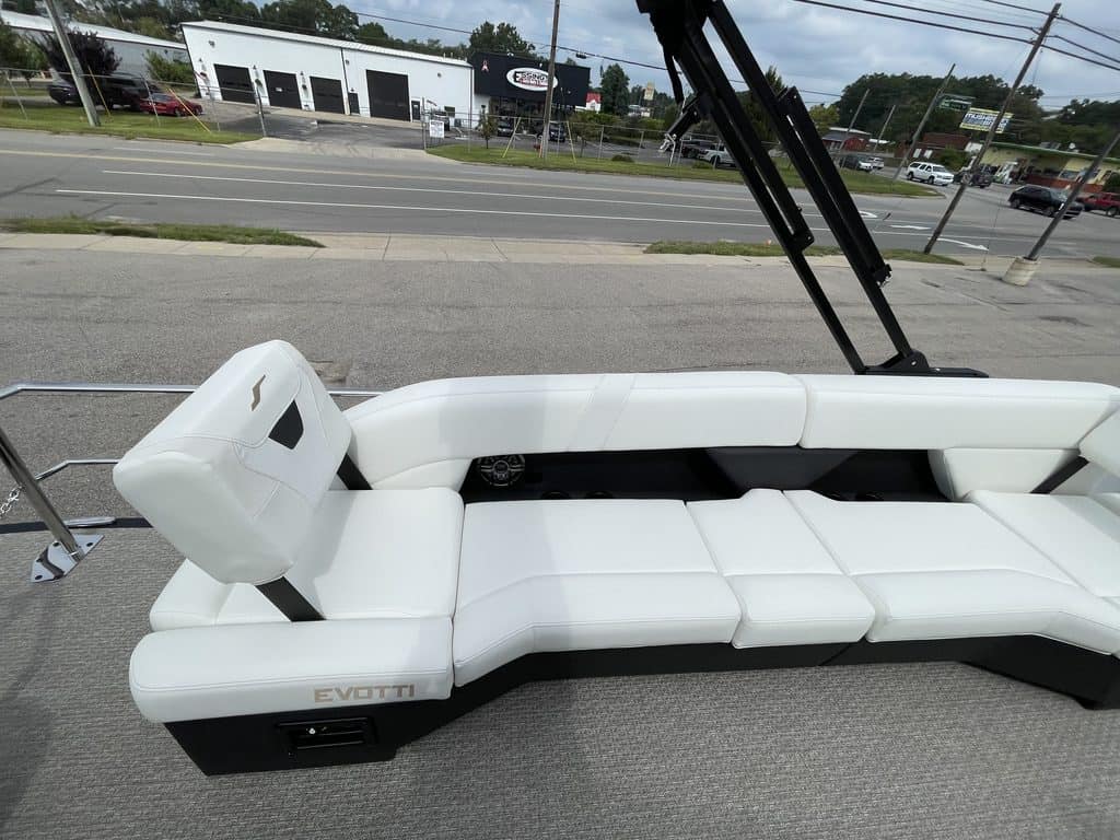 Luxury EVOTTI 523CL boat with white seating and black accents.