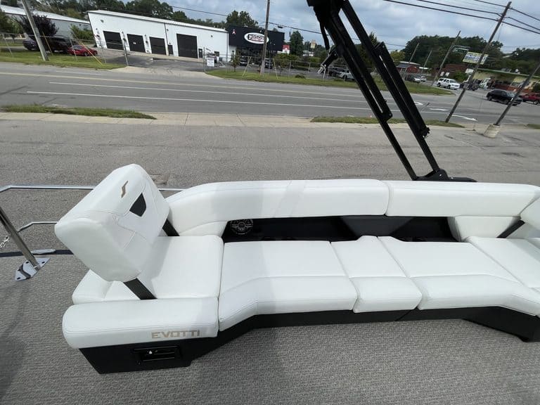 Luxury EVOTTI 523CL boat with white seating and black accents.