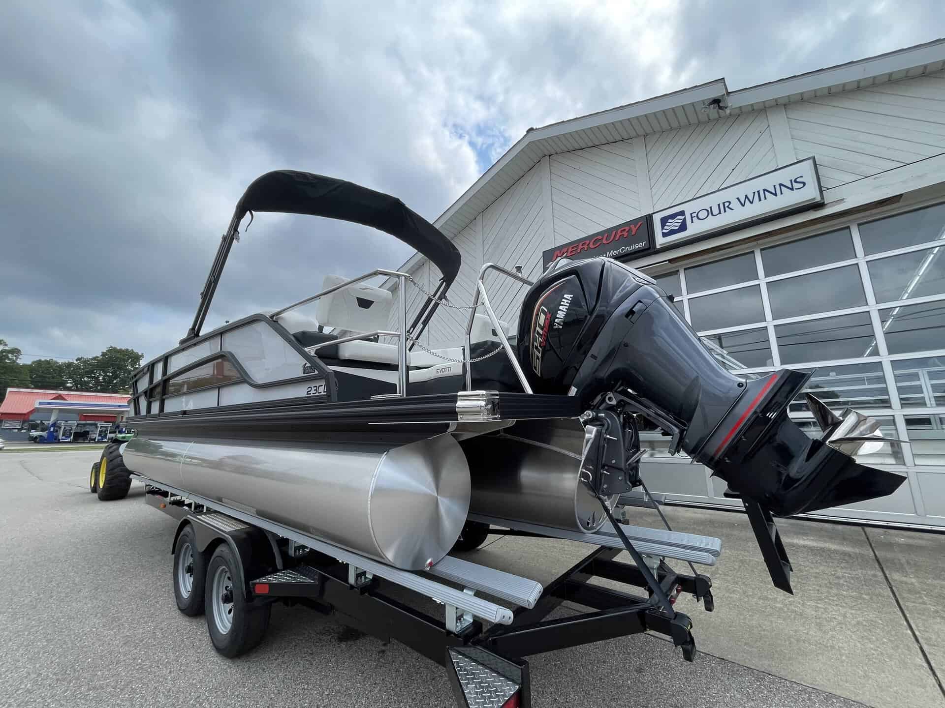 Pontoon boat with outboard motor at Hall's Sport Center.