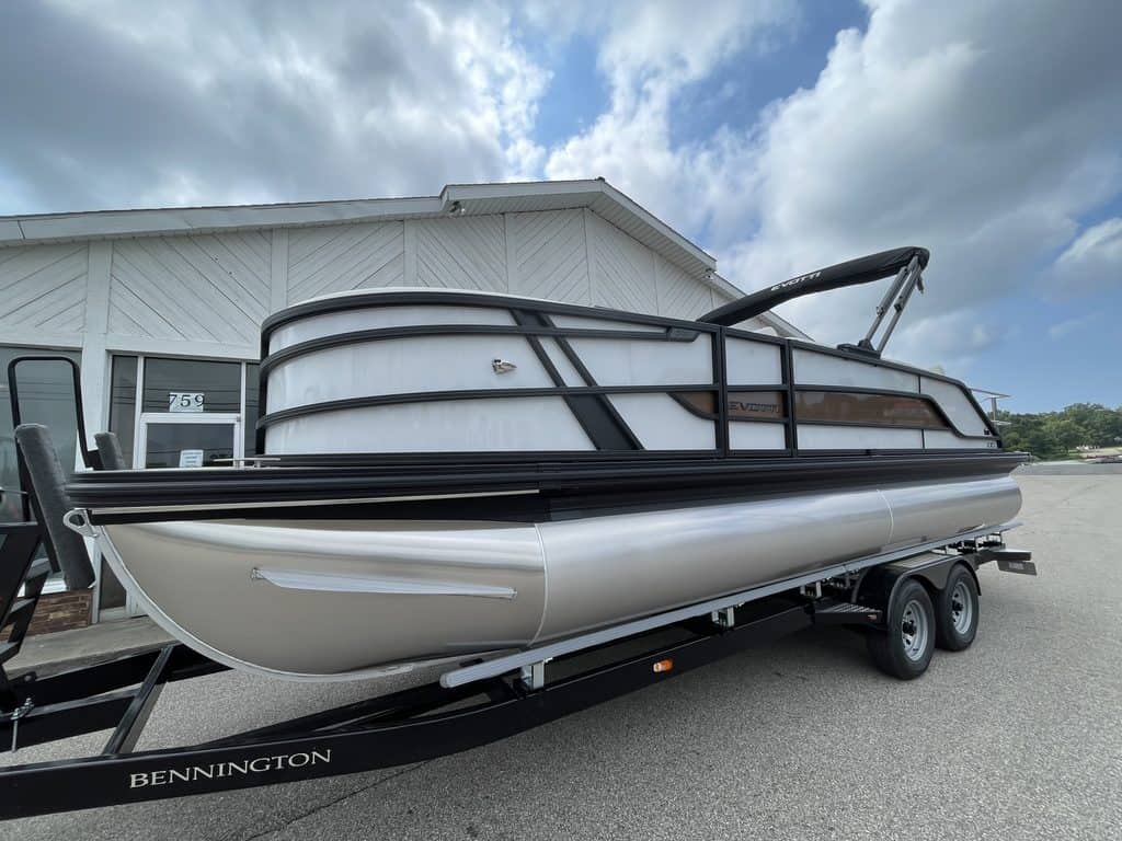 Bennington pontoon boat on trailer at Hall's Sport Center for sale or rent.