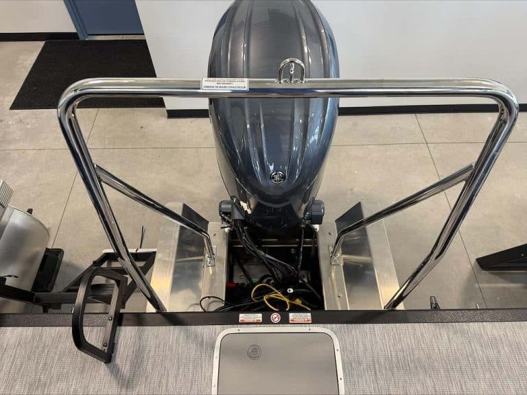 Outboard motor on display at Hall's Sport Center for boating enthusiasts.