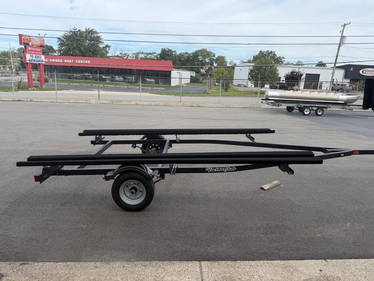 Boat trailer parked on the street near Hall's Sport Center.