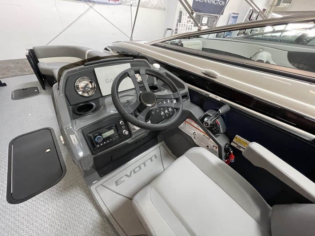 Close-up of the helm station in the 2027 EVOTTI 525QL boat.