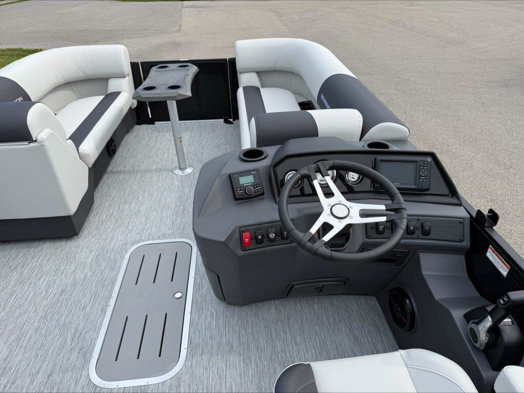 Bennington 22 S1SB pontoon boat helm with steering wheel and controls.