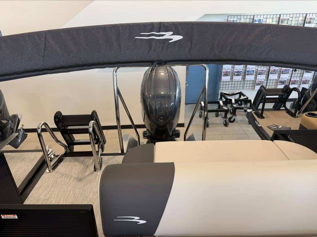 Fitness equipment at Hall's Sport Center with treadmill and weights.