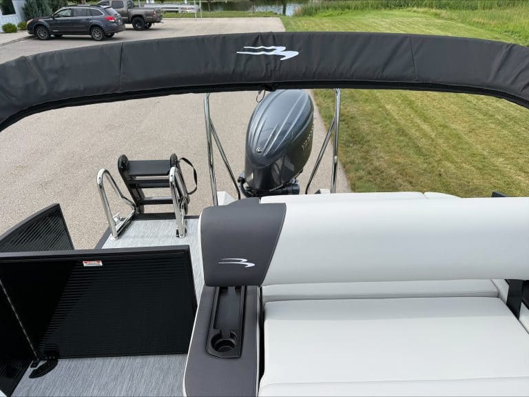 Bennington 22 S1SB pontoon boat with outboard motor and seating.