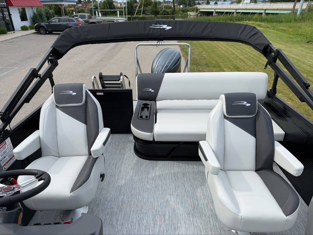 Bennington 22 S1SB pontoon boat interior with seating and steering wheel.