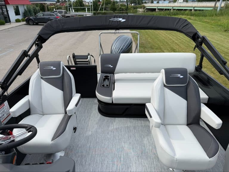 Bennington 22 S1SB pontoon boat interior with seating and steering wheel.