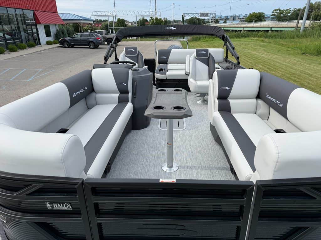 Bennington 22 S1SB pontoon boat with seating and canopy in outdoor setting.