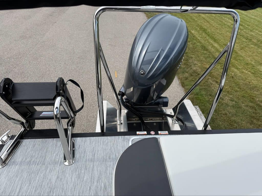 Bennington 22 S1SB boat with outboard motor and seating area.