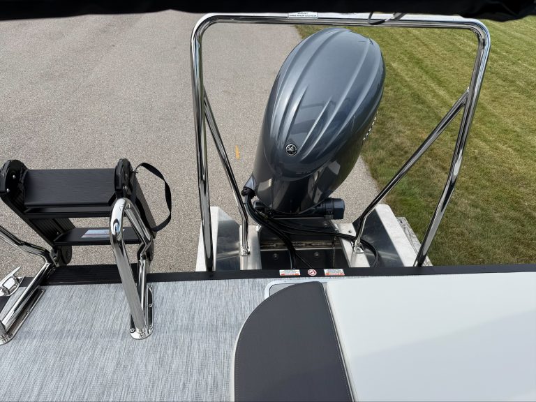 Bennington 22 S1SB boat with outboard motor and seating area.