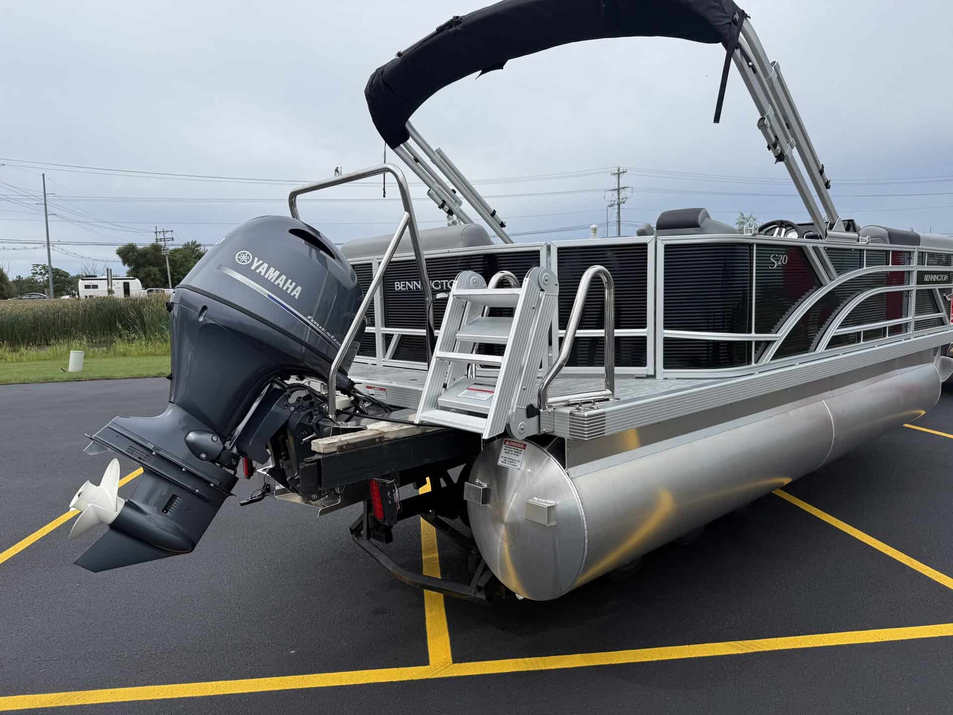 Pontoon boat with Yamaha outboard motor at Hall's Sport Center.