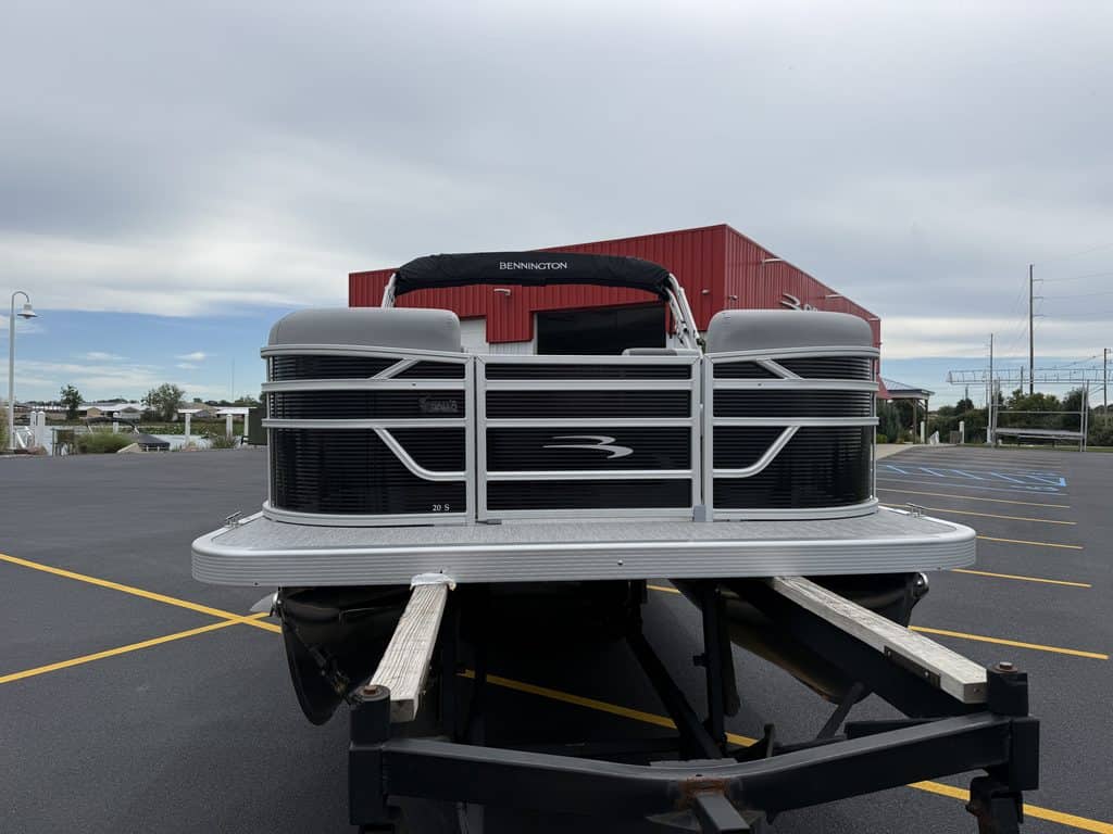 Bennington pontoon boat parked in lot at Hall's Sport Center.