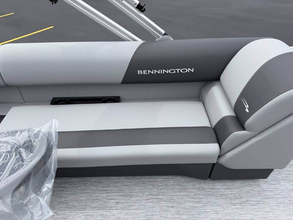 Bennington boat seat with gray and white upholstery at Hall's Sport Center.