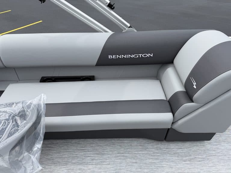 Bennington boat seat with gray and white upholstery at Hall's Sport Center.