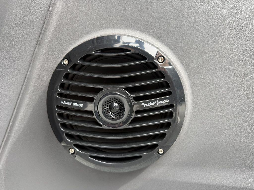 Marine grade speaker installed in a vehicle ceiling at Hall's Sport Center.