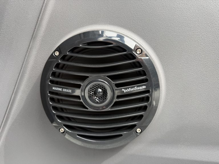 Marine grade speaker installed in a vehicle ceiling at Hall's Sport Center.