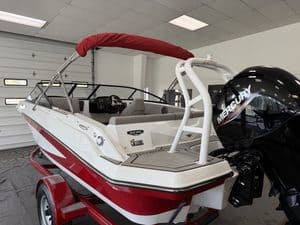 White and red Glastron GX190 boat with Mercury outboard motor.