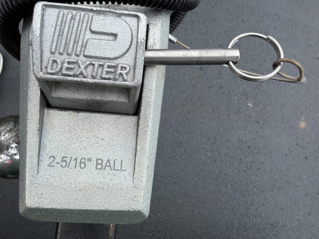Dexter ball hitch lock with key for trailer security.