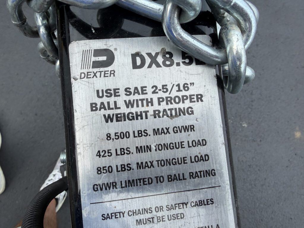 Trailer hitch chain with load capacity label for safety and proper use.
