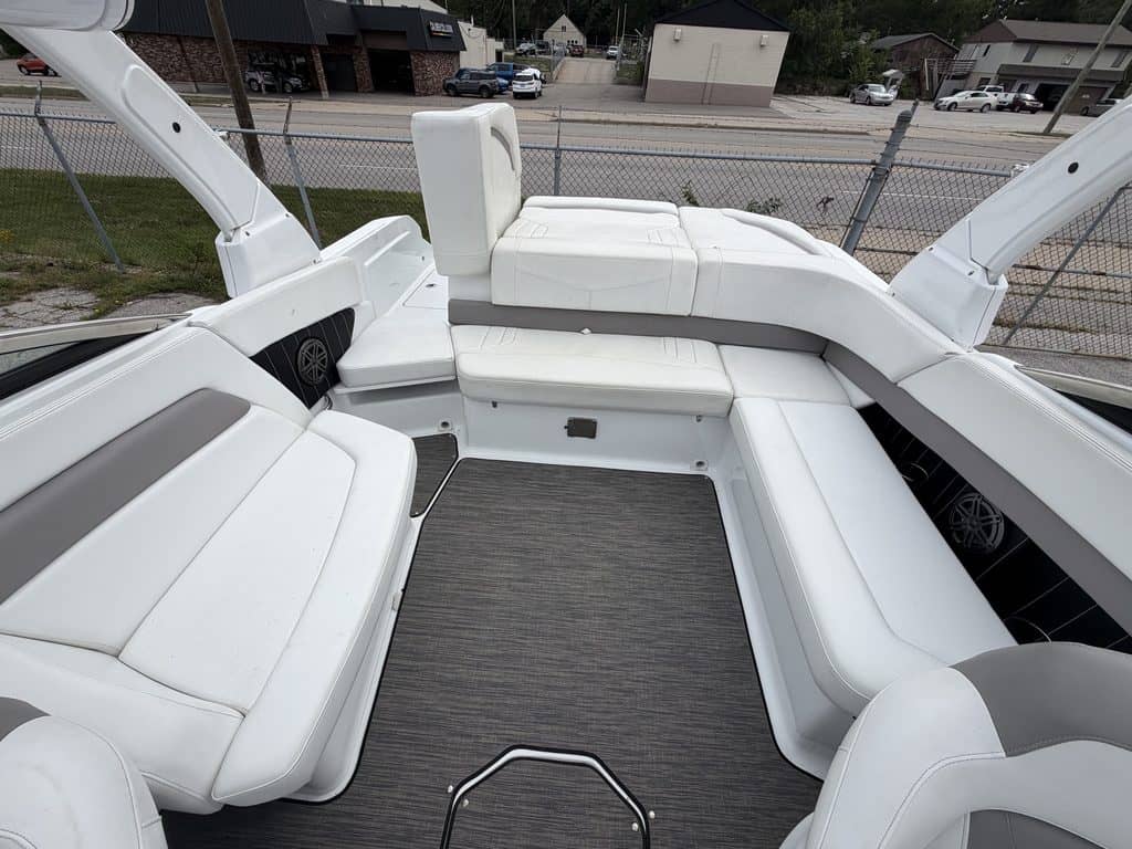 Luxury boat interior with white seating and modern design features.