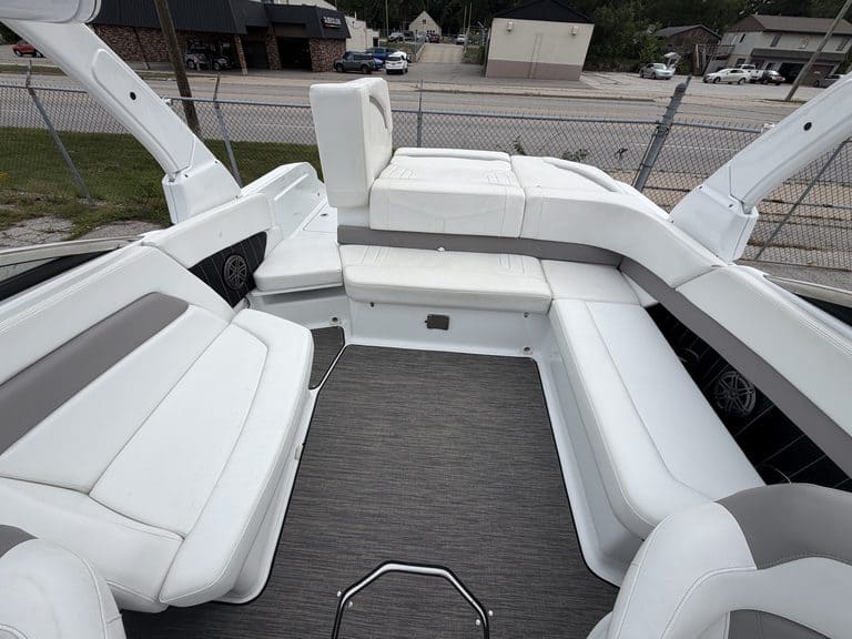 Luxury boat interior with white seating and modern design features.