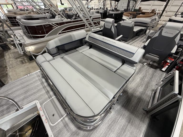 Bennington 23 SSB pontoon boat with seating and steering console.