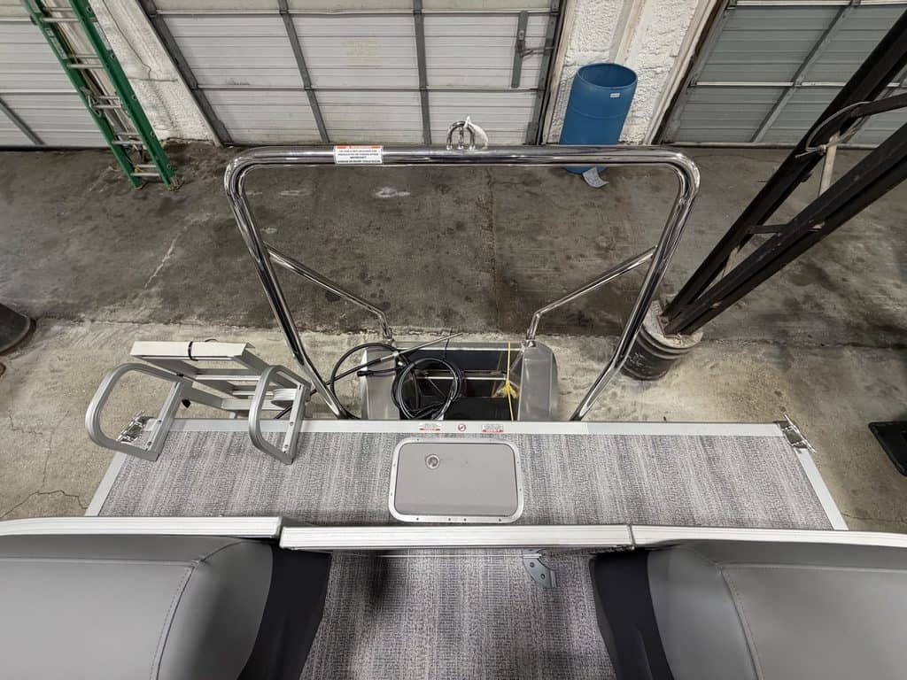 View of boat deck with ladder and railing at Hall's Sport Center.
