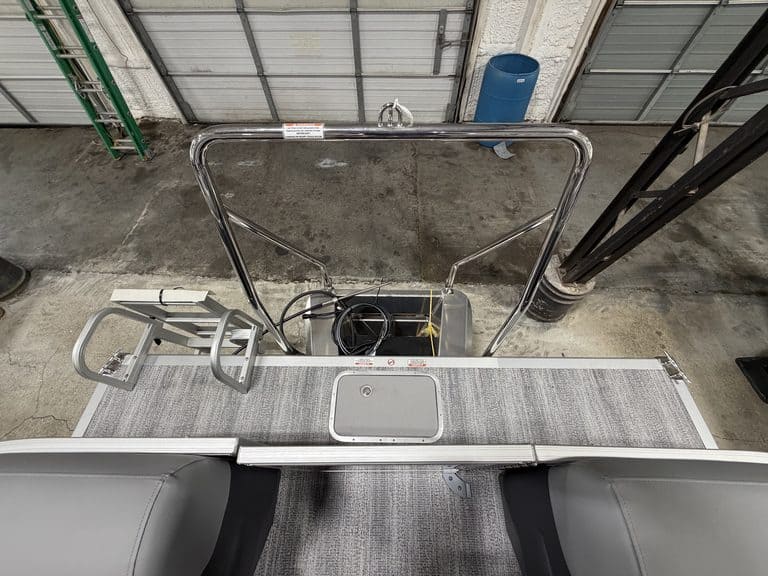 View of boat deck with ladder and railing at Hall's Sport Center.