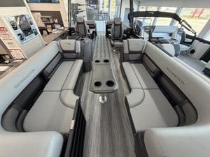 Bennington 23 SSR pontoon boat interior with seating and steering console.