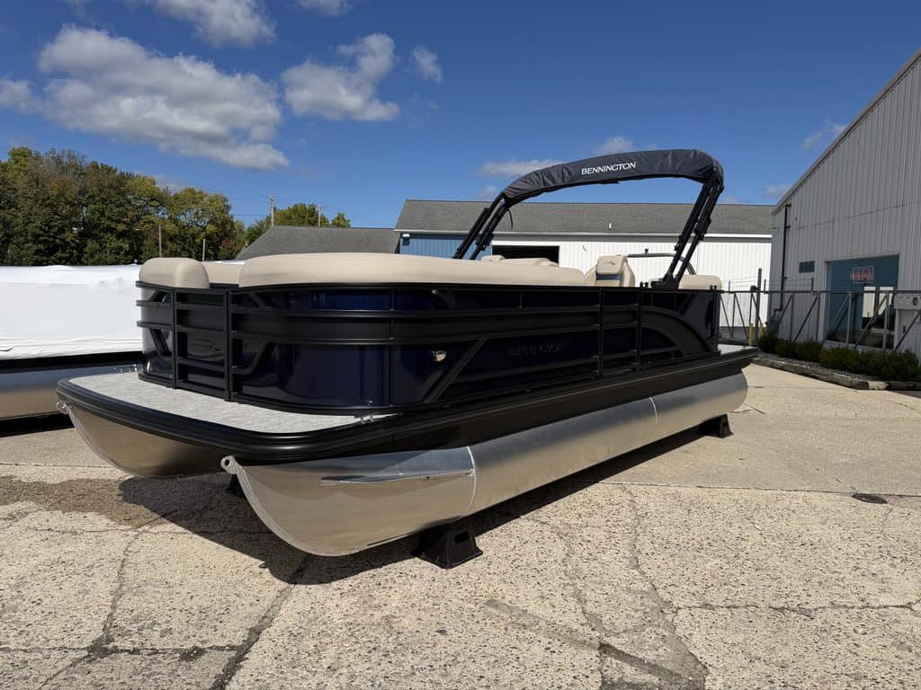 Bennington 21 SSR pontoon boat with beige seats and black exterior.