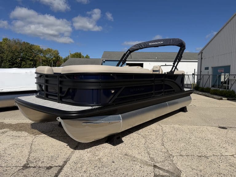 Bennington 21 SSR pontoon boat with beige seats and black exterior.