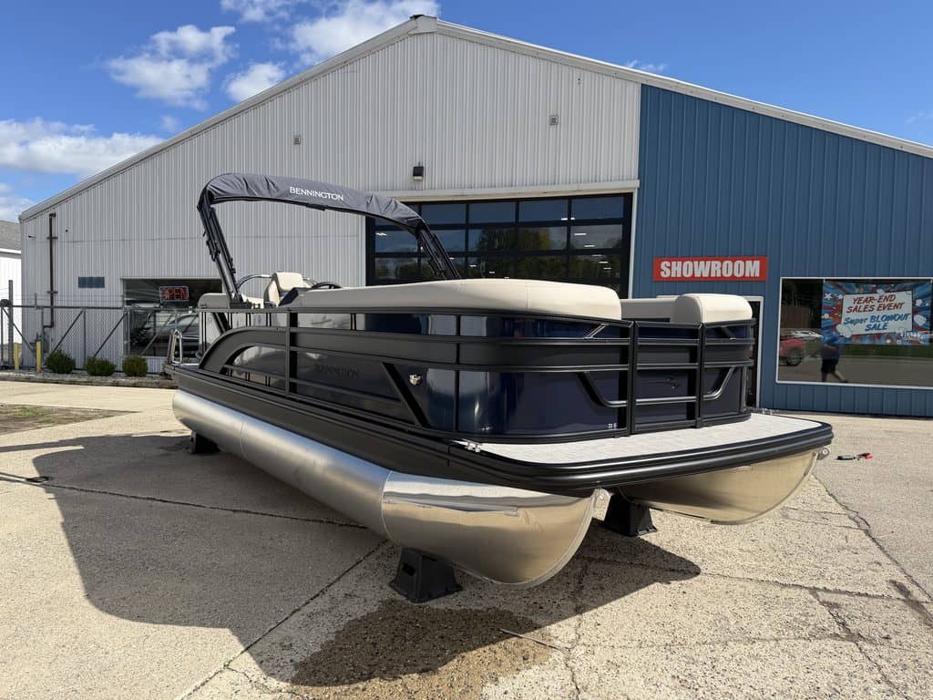 Bennington 21 SSR pontoon boat outside Hall's Sport Center showroom.
