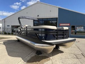 Bennington 21 SSR pontoon boat outside Hall's Sport Center showroom.