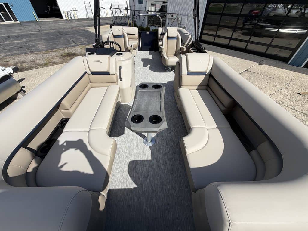 Bennington 21 SSR pontoon boat with beige seating and center console.